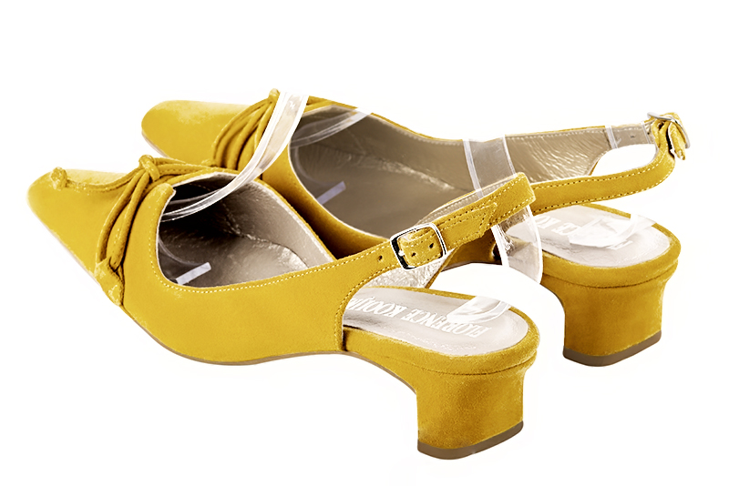 Yellow women's open back shoes, with a knot. Tapered toe. Low kitten heels. Rear view - Florence KOOIJMAN